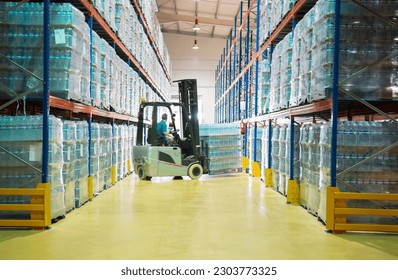 Worker moving pallets with forklift in warehouse - Powered by Shutterstock