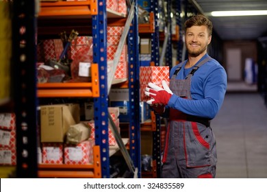 Worker On A Automotive Spare Parts Warehouse 