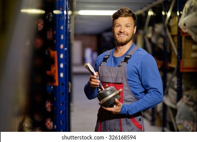 Worker On A Automotive Spare Parts Warehouse 