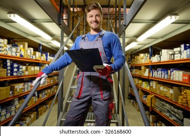 Worker On A Automotive Spare Parts Warehouse 