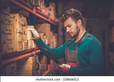 Worker On A Automotive Spare Parts Warehouse 