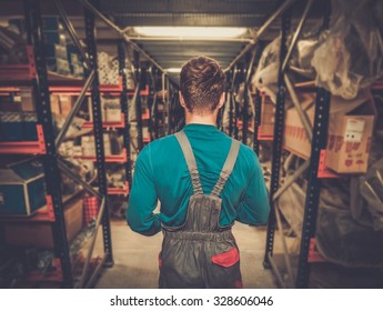 Worker On A Automotive Spare Parts Warehouse 