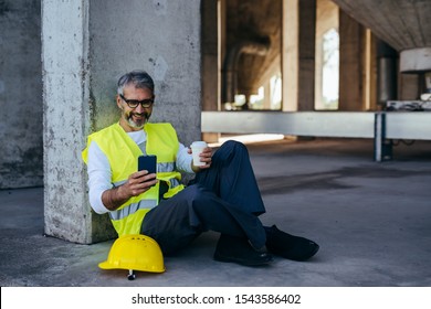 Worker On Lunch Break, Sitting On Construction Site