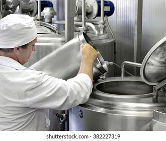 Worker On A Modern Milk Factory 