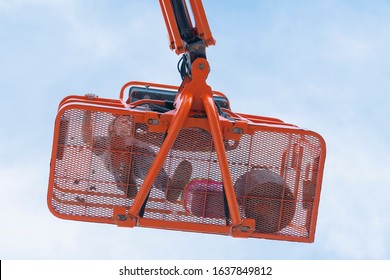 Worker On A Telescopic Boom Lift Platform