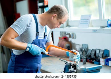  Worker On Work Bench In The Factory