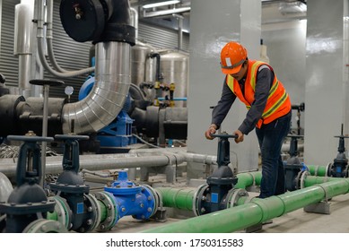 The Worker Opens The Water Valve Of The Chiller.