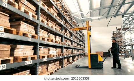 Worker operating forklift in large warehouse. A worker operates a yellow forklift in a spacious warehouse filled with stacked wooden crates. - Powered by Shutterstock