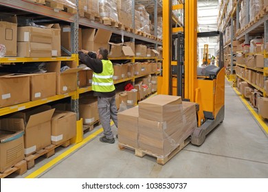 Worker Order Picking In Fulfillment Warehouse