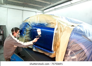 Worker Painting A Car.