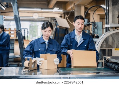 A worker performing shipping operations at a distribution center - Powered by Shutterstock