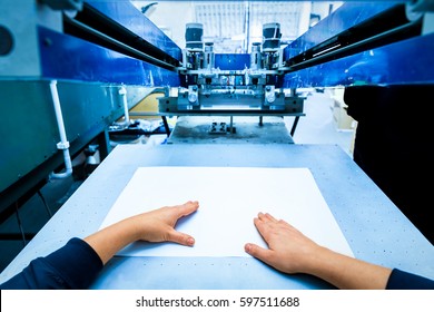 Worker Preparing Print Screening Metal Machine. Industrial Printer. Manufacture Work. First Person Perspective.