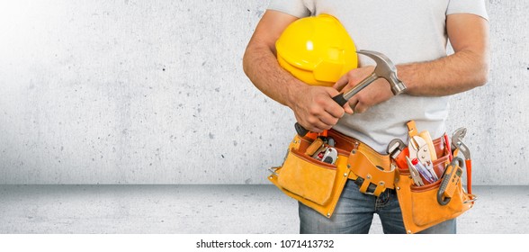 Worker And Professional Builder With Tools