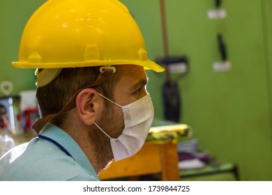 worker in protective mask, worker in medical mask, construction worker with yellow helmet - Shutterstock ID 1739844725