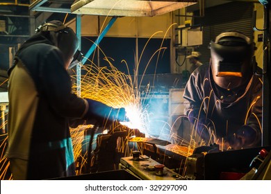 worker with protective mask welding metal - Shutterstock ID 329297090