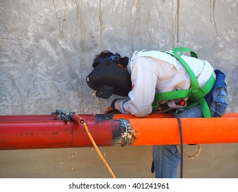 worker with protective mask welding metal - Shutterstock ID 401241961