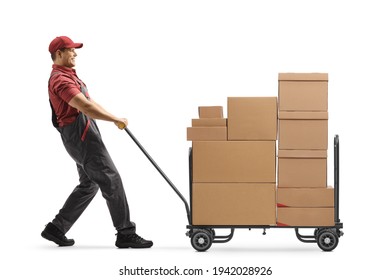 Worker pulling a hand truck loaded with cardboard boxes isolated on white background - Powered by Shutterstock