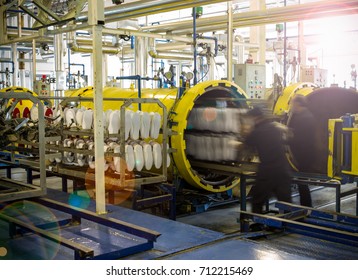 Worker Put White Leather Shoes In To Hot Oven In Production Line Of Footwear Factory