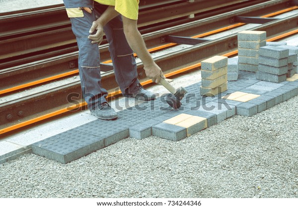 Worker Putting Down Patio Pavers On Stock Photo Edit Now 734244346