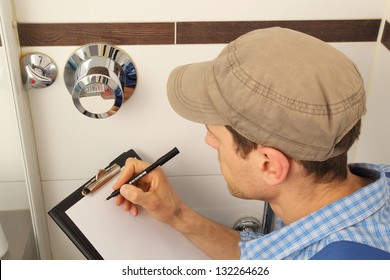 Worker Reading Tap Water Meter