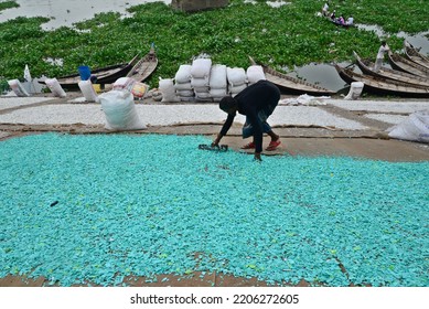 Worker Recycled Plastic Chips Drying Under The Sun On The Bank Of The Buriganga River In Dhaka, Bangladesh, On September 25, 2022. 