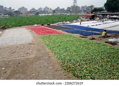 Worker Recycled Plastic Chips Drying Under The Sun On The Bank Of The Buriganga River In Dhaka, Bangladesh, On September 25, 2022. 