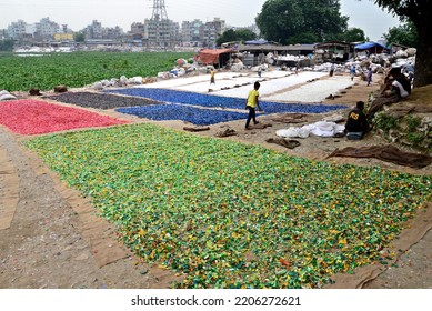 Worker Recycled Plastic Chips Drying Under The Sun On The Bank Of The Buriganga River In Dhaka, Bangladesh, On September 25, 2022. 