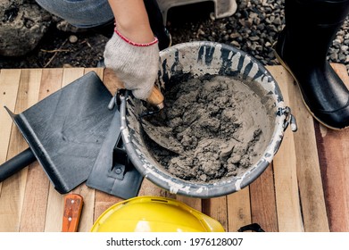 Worker Repair And Fix Cement Fence At Home. DIY Construction And Renovate House.