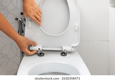 Worker replace hinge rubber plug and Screws for Toilet Seat