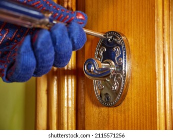 The Worker Replaces The Broken Door Handle.