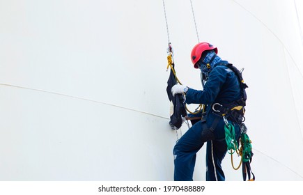 Worker Rope Access Check Wall Thickness Of Chemical Storage Tank