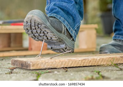 Worker With Safety Boots Steps On A Nail