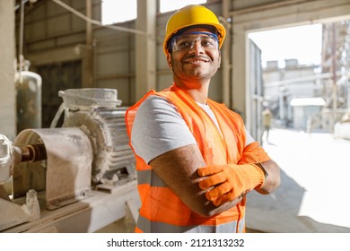 Worker with safety equipment working at construction plant - Powered by Shutterstock