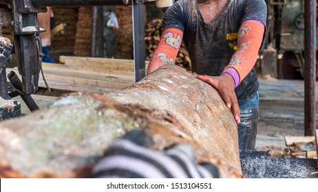 worker sawing a hardwood on saw table in Thailand - Shutterstock ID 1513104551