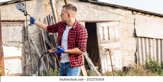 Worker at the sawmill controls the remote control