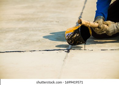 Worker Sealing Asphaltic Joint For Construction Joint On Concrete Pavement, Filling Expansion Joint Concrete Pavement.