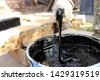 bucket of tar