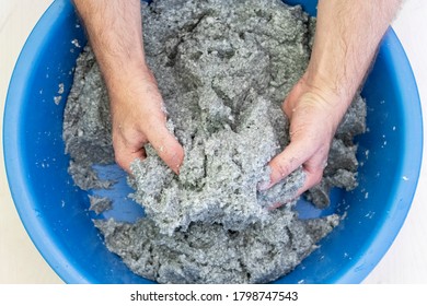 Worker Soaks And Mixes Silk Plaster. Preparation For Pasting Liquid Wallpaper In Apartment.