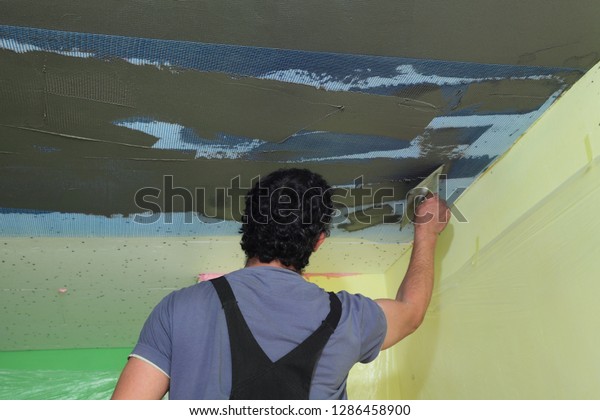 Worker Spreading Mortar Over Styrofoam Ceiling Stock Photo Edit