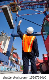 Worker Supervising Loading Of Containers At Port