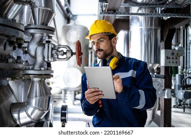 Worker Supervisor In District Heating Plant Doing Quality Control And Inspection Of Pipes And Valves.