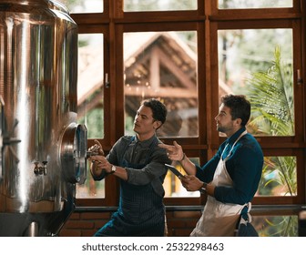 Worker, tablet and examine tank in brewery for machine inspection, quality assurance and production management. Team, people and digital app in small business for checking beer manufacturing system - Powered by Shutterstock