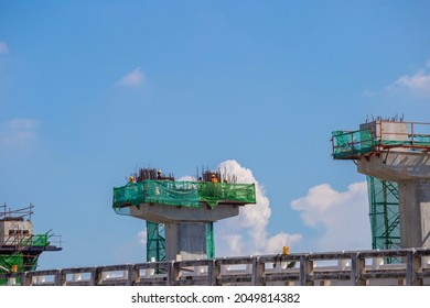 Worker Team On Building Site, Construction Of A Mass Transit Train Line In Progress With Heavy Infrastructure, Infrastructure Construct Concepts