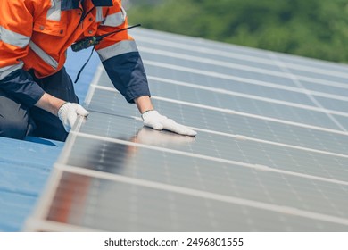 Worker Technicians are working to construct solar panels system on roof. Installing solar photovoltaic panel system. Men technicians walking on roof structure to check photovoltaic solar modules.