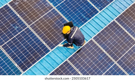 Worker Technicians are working to construct solar panels system on roof. Installing solar photovoltaic panel system. Men technicians walking on roof structure to check photovoltaic solar modules.