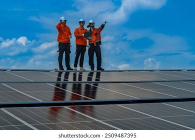 Worker Technicians are working to construct solar panels system on roof. Installing solar photovoltaic panel system. Men technicians walking on roof structure to check photovoltaic solar modules.