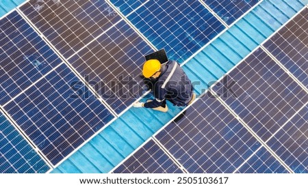 Worker Technicians are working to construct solar panels system on roof. Installing solar photovoltaic panel system. Men technicians walking on roof structure to check photovoltaic solar modules.