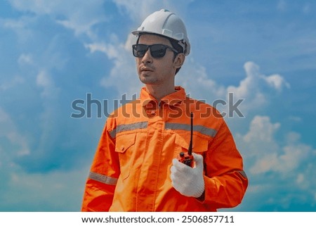 Worker Technicians are working to construct solar panels system on roof. Installing solar photovoltaic panel system. Men technicians walking on roof structure to check photovoltaic solar modules.