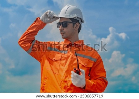 Worker Technicians are working to construct solar panels system on roof. Installing solar photovoltaic panel system. Men technicians walking on roof structure to check photovoltaic solar modules.