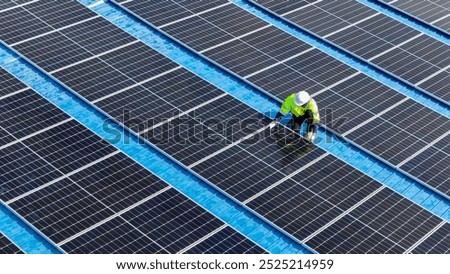 Worker Technicians are working to construct solar panels system on roof. Installing solar photovoltaic panel system. Men technicians walking on roof structure to check photovoltaic solar modules.
